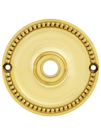3 1/4 inch Beaded Brass Rosette For Pre-drilled Doors in Unlacquered Brass.